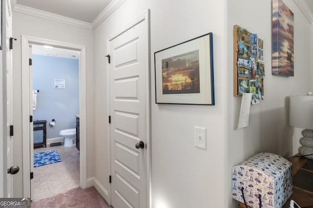 hallway featuring crown molding