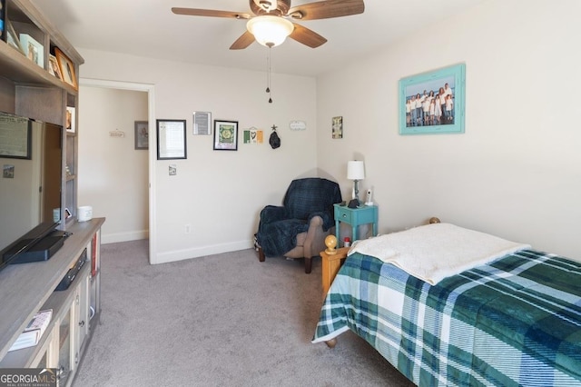 bedroom featuring ceiling fan and light carpet