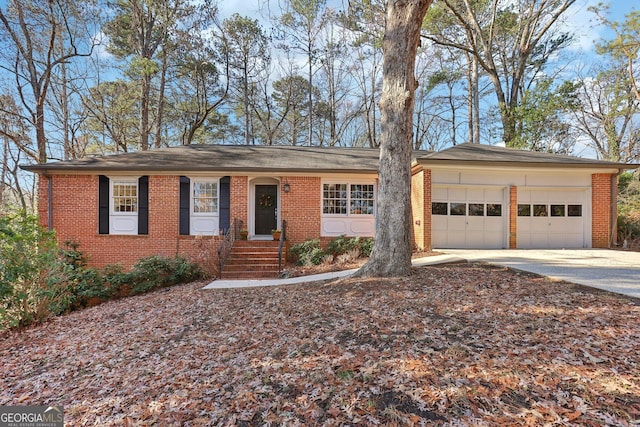 ranch-style home featuring a garage