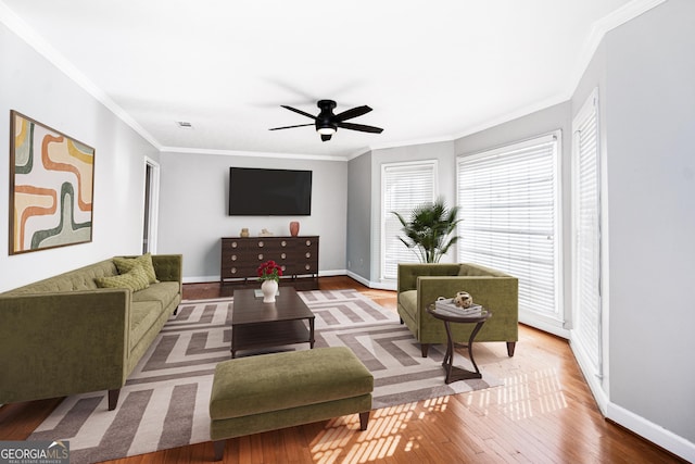 living room with crown molding, ceiling fan, and hardwood / wood-style floors