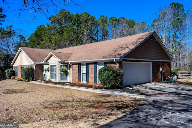 ranch-style home featuring a garage