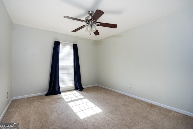 unfurnished room with light carpet and ceiling fan