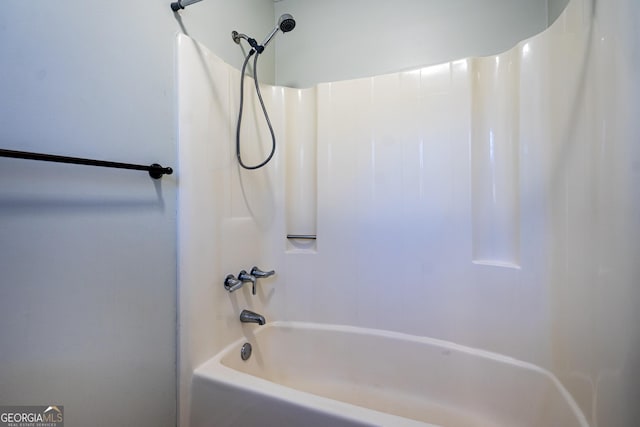 bathroom with shower / washtub combination