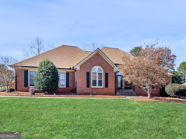 ranch-style house featuring a front yard