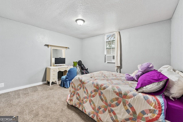 carpeted bedroom featuring a textured ceiling