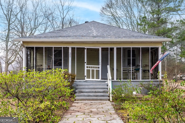 bungalow-style house featuring a sunroom