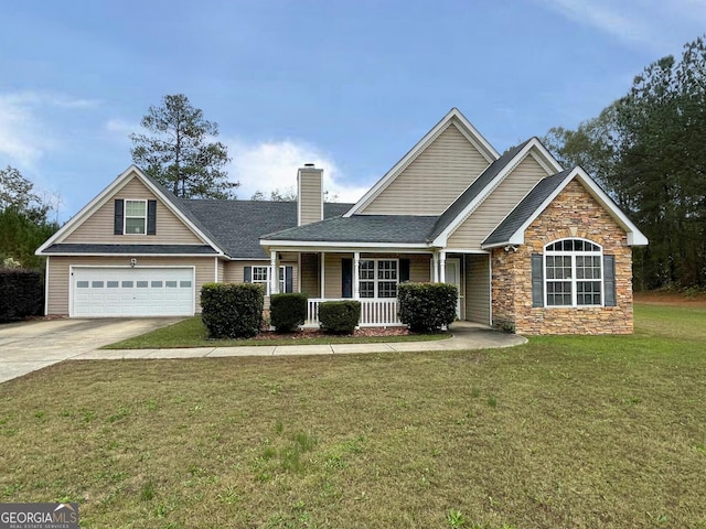 view of front facade featuring a garage, covered porch, and a front lawn