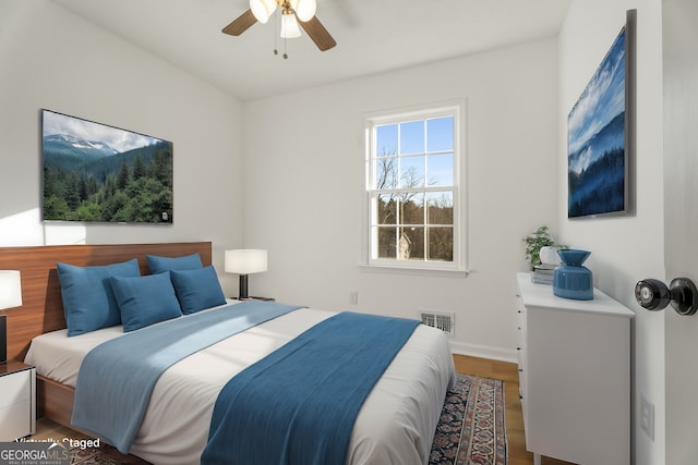 bedroom featuring wood-type flooring and ceiling fan