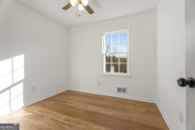 unfurnished room with ceiling fan and light hardwood / wood-style flooring