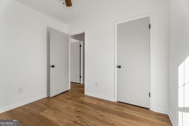 unfurnished bedroom with light wood-type flooring