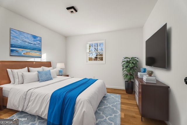 bedroom featuring hardwood / wood-style floors