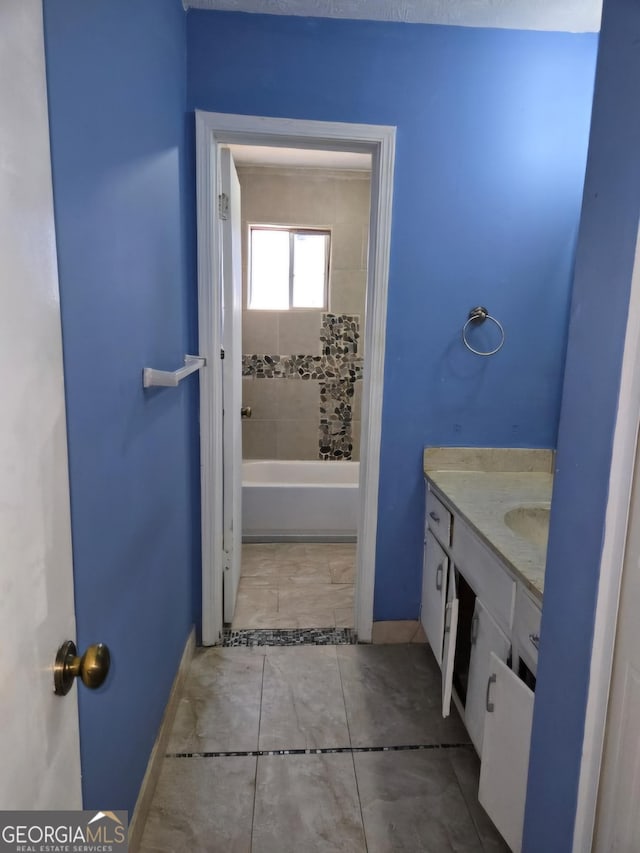 bathroom with vanity and a bathtub