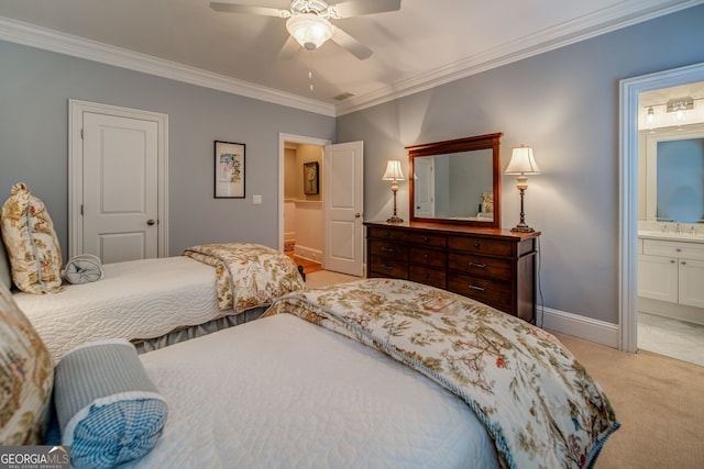 carpeted bedroom featuring ceiling fan, ornamental molding, ensuite bathroom, and sink