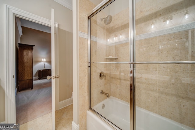 bathroom featuring bath / shower combo with glass door and ornamental molding