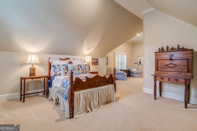 bedroom with ornamental molding, lofted ceiling, and carpet