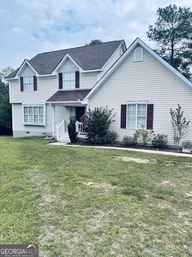 view of front facade featuring a front yard