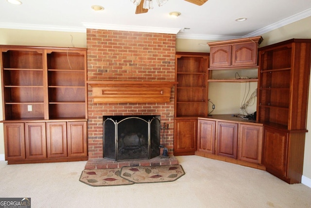 unfurnished living room featuring light carpet, a fireplace, crown molding, and recessed lighting