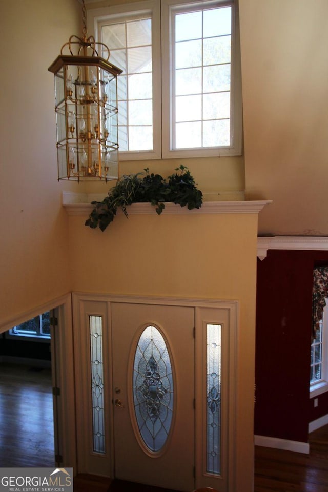 foyer featuring wood finished floors