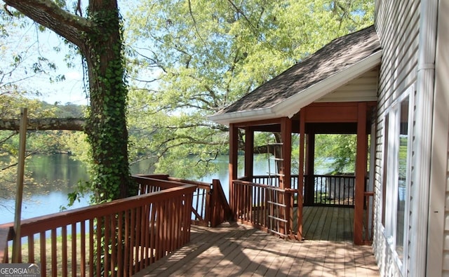 deck featuring a water view