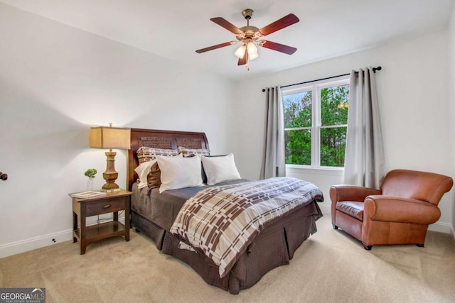 bedroom featuring light carpet and ceiling fan