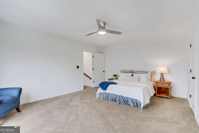 bedroom featuring light colored carpet and ceiling fan