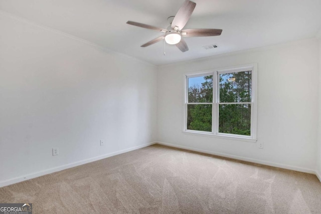 unfurnished room featuring carpet floors and ceiling fan