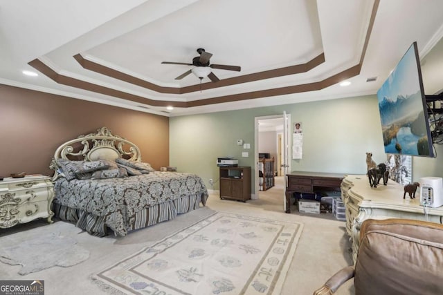 bedroom with ornamental molding, a raised ceiling, and carpet flooring