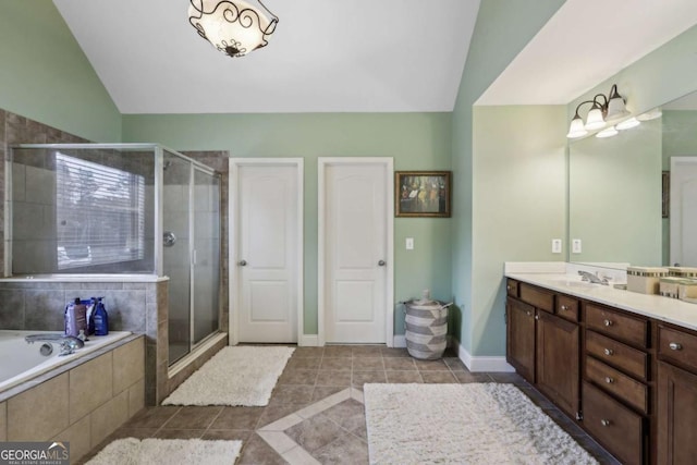 bathroom with vanity, tile patterned flooring, vaulted ceiling, and separate shower and tub