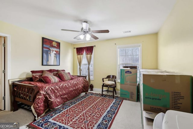 bedroom with ceiling fan and carpet flooring