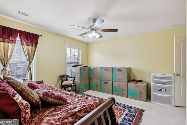 bedroom with ceiling fan and carpet flooring