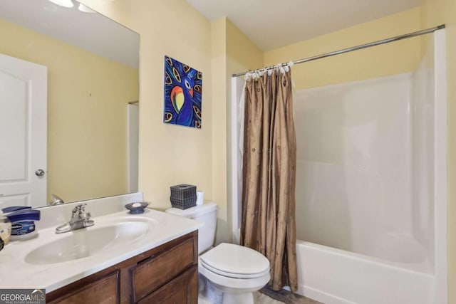 full bathroom featuring vanity, shower / bath combo, and toilet