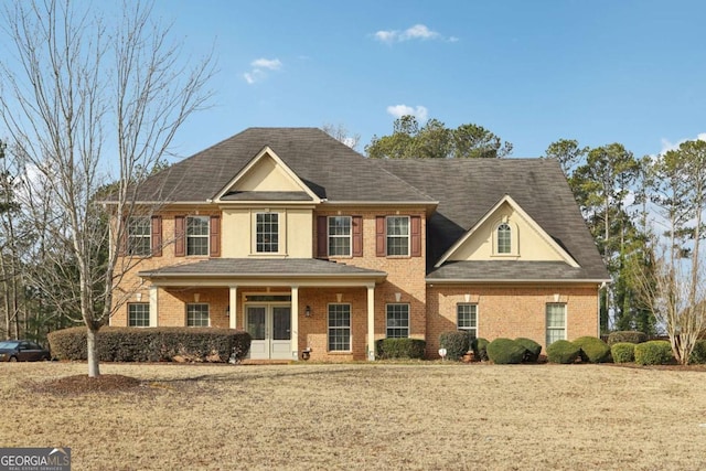 view of front of property featuring a porch and a front lawn