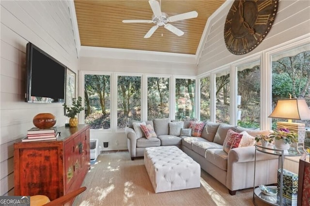 sunroom with ceiling fan, lofted ceiling, plenty of natural light, and wood ceiling