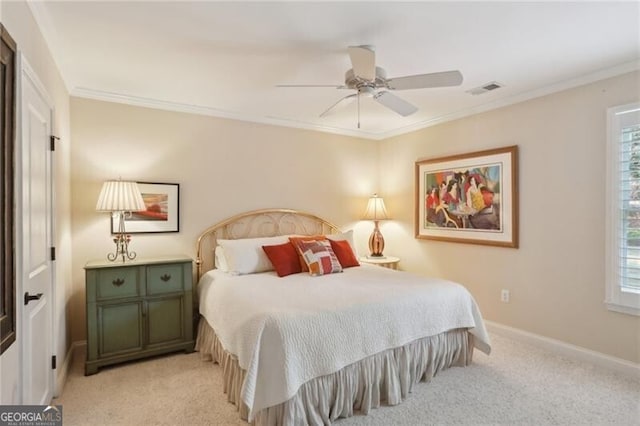 bedroom featuring multiple windows, crown molding, and light colored carpet