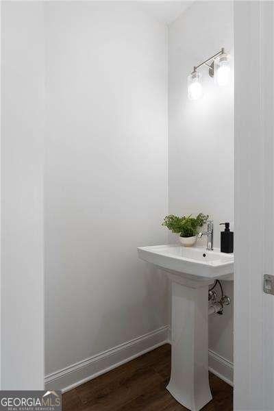 bathroom featuring wood-type flooring