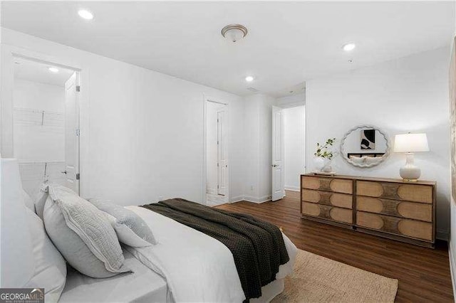 bedroom featuring dark hardwood / wood-style flooring