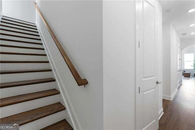 stairs with hardwood / wood-style floors