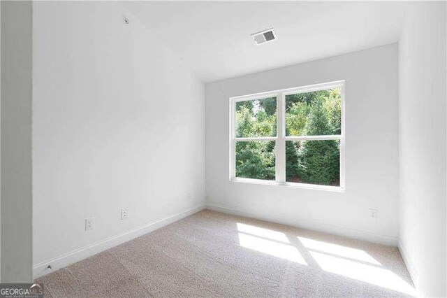 unfurnished room featuring carpet flooring