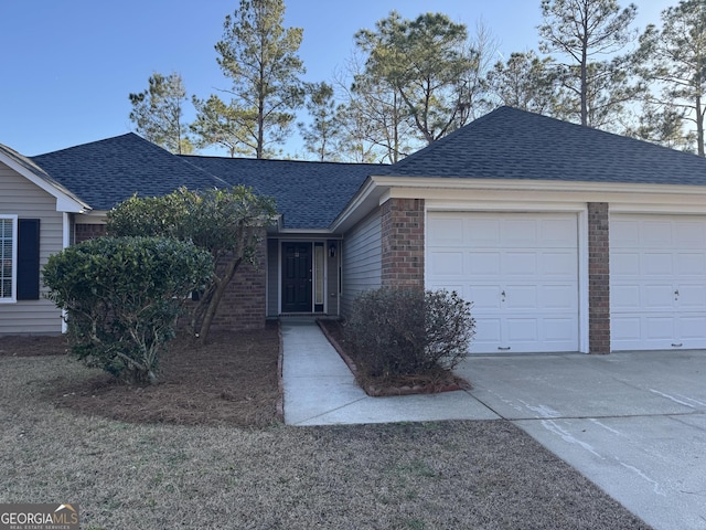 single story home featuring a garage