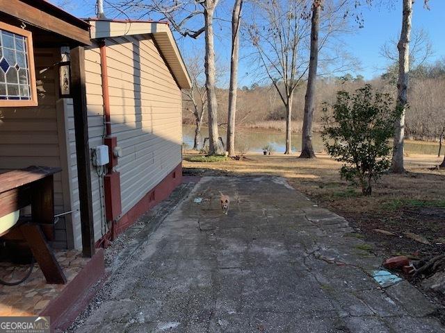 view of side of home featuring a patio