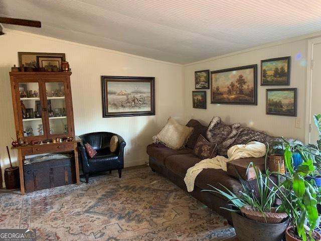 living room with vaulted ceiling and carpet flooring