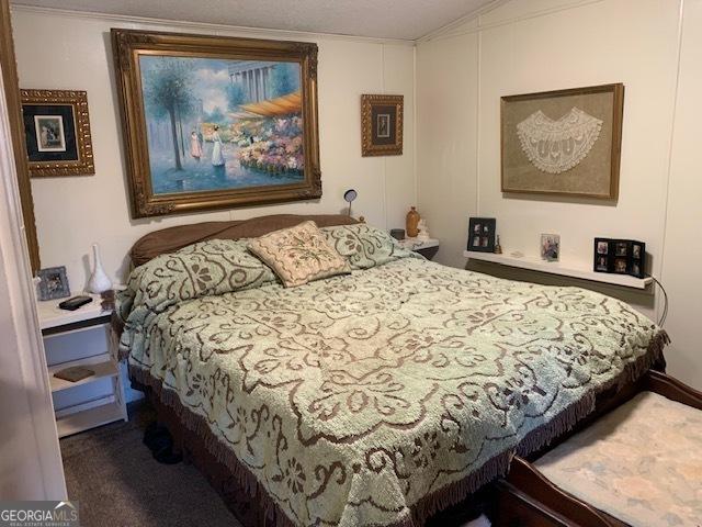 bedroom featuring vaulted ceiling