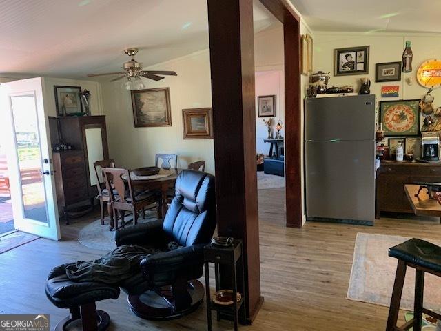 interior space featuring vaulted ceiling, ceiling fan, and light hardwood / wood-style floors