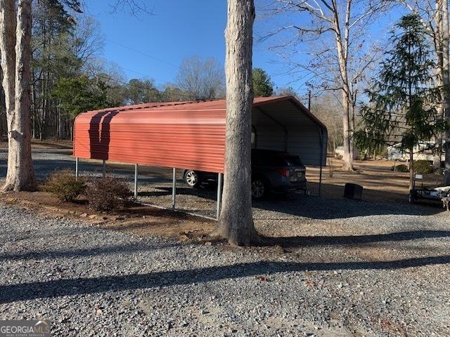 exterior space with a carport