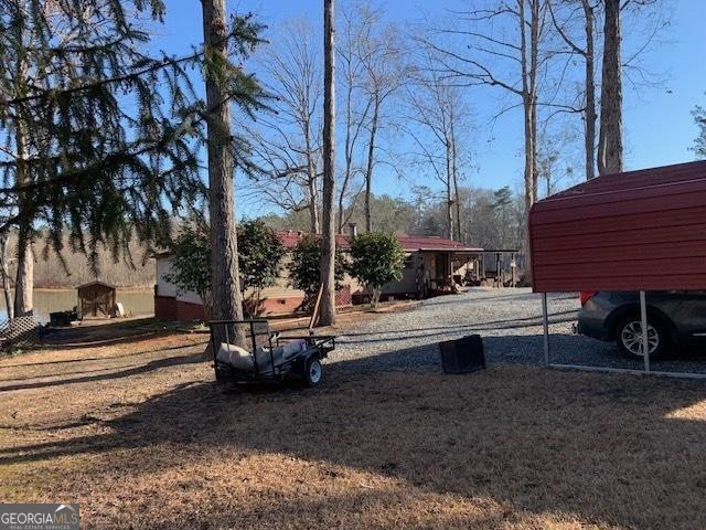 view of yard featuring a carport