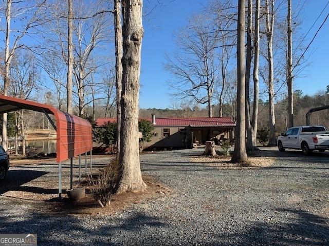 view of yard with a carport