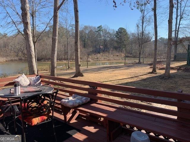 surrounding community featuring a water view