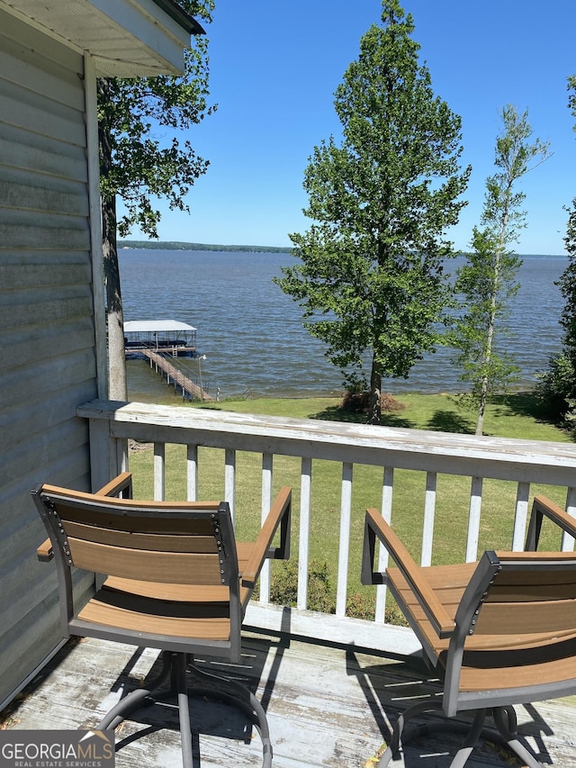 balcony featuring a water view