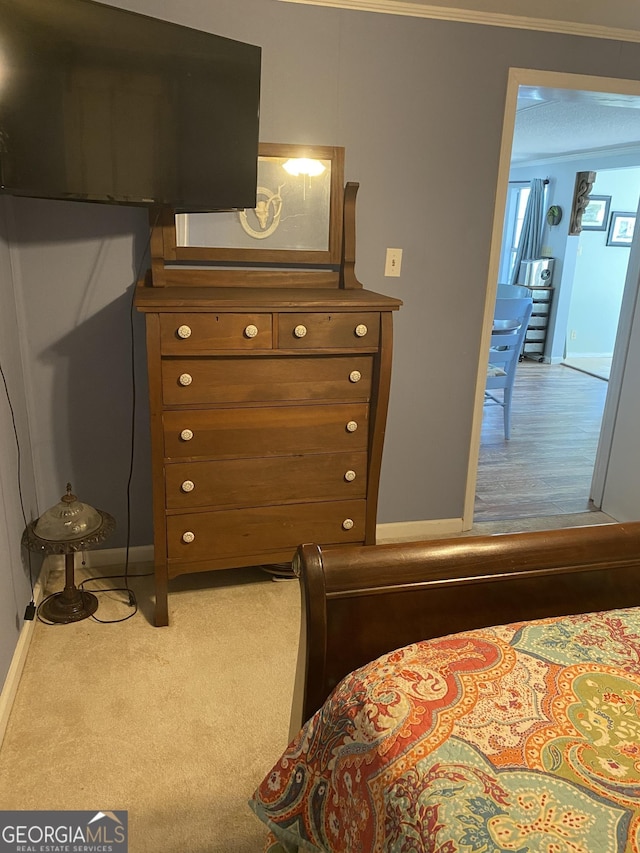bedroom with baseboards and carpet floors