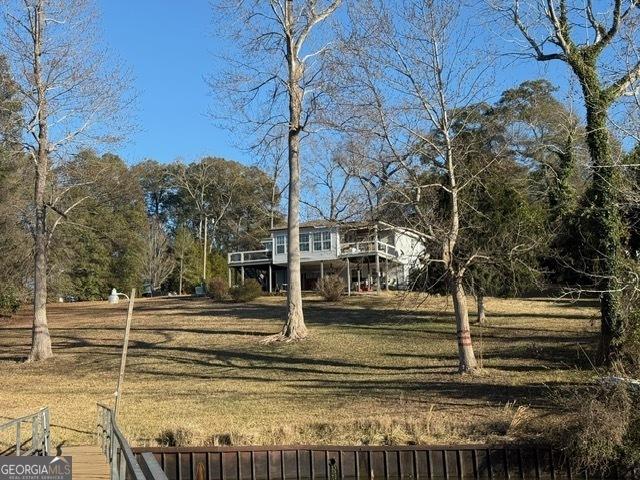 view of yard with a wooden deck